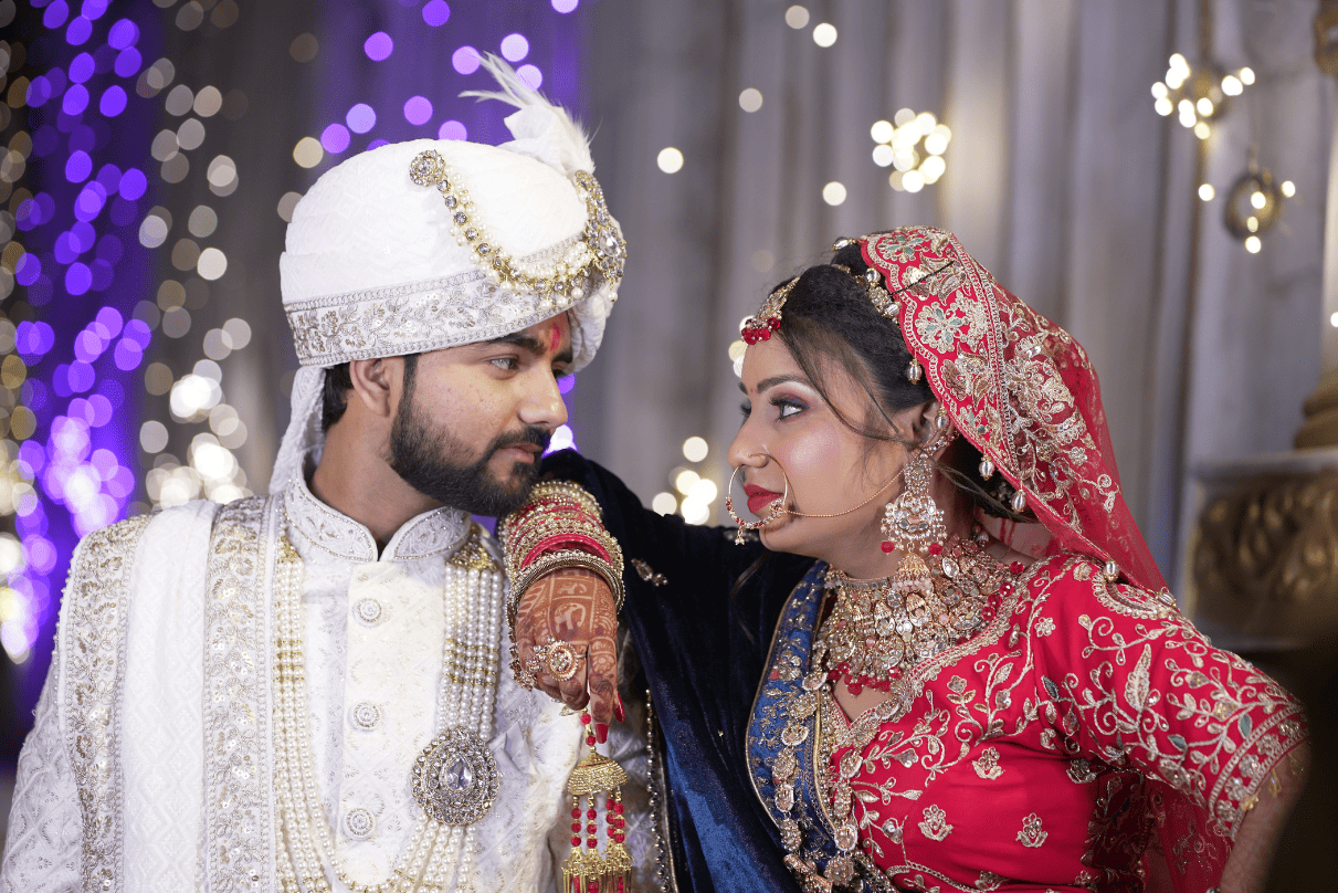 Romantic wedding moment – bride and groom pose captured by best wedding photographer in Delhi