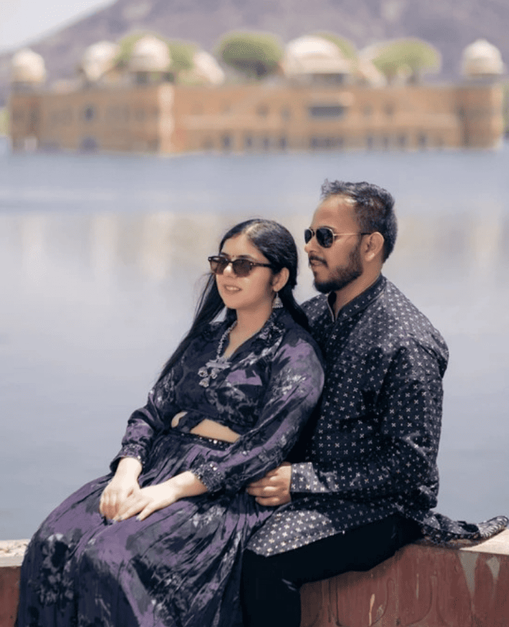 Romantic pre-wedding shoot in Jaipur with couple standing in front of car, clicked by SK Digital Photo Studio
