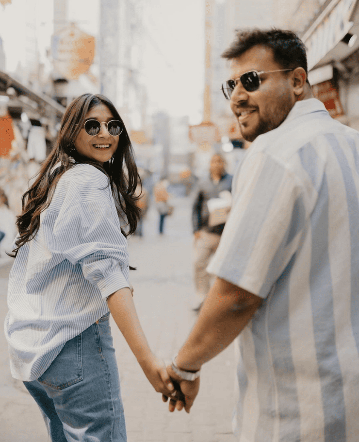 Romantic pre-wedding shoot in Delhi with couple walking hand in hand on street, captured by SK Digital Photo Studio
