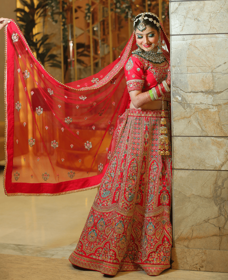 Bride in a red lehenga photographed by SK Digital Photo Studio